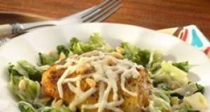 Roasted Chicken Thighs over Braised Escarole with Pine Nuts and Mozzarella