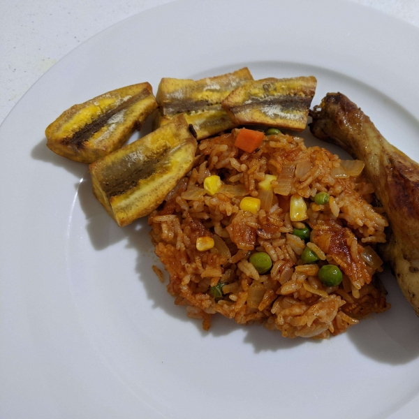 Nigerian Jollof Rice with Chicken and Fried Plantains