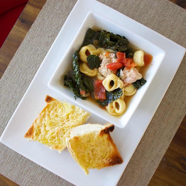 Hearty Chicken and Tortellini Stew with Cheesy Garlic Bread