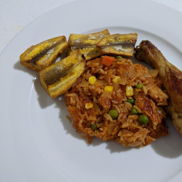 Nigerian Jollof Rice with Chicken and Fried Plantains