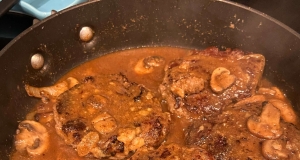 Smothered Pork Chops with Bourbon and Mushrooms