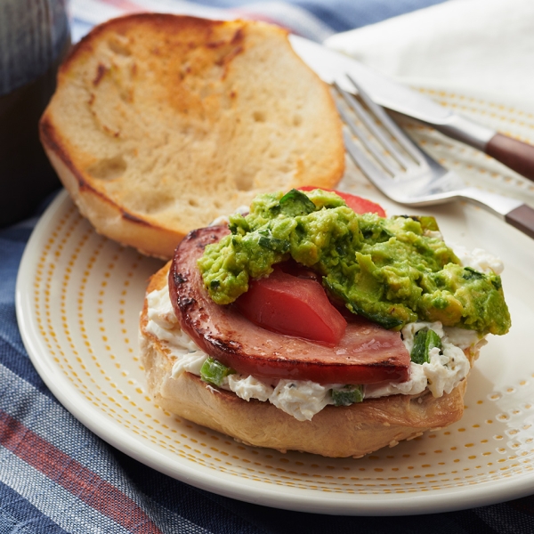 Ham Bagel with Smashed Avocado, Tomato, and Roasted Jalapeno Cream Cheese