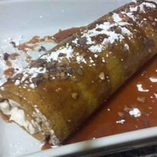 Pumpkin Roll with Toffee Cream Filling and Caramel Sauce
