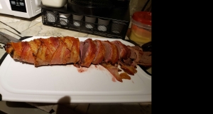 Bacon-Wrapped Venison Tenderloin with Garlic Cream Sauce