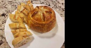 Baked Stuffed Brie with Cranberries & Walnuts